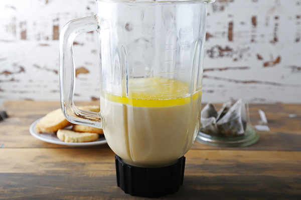 Blended ketoproof green tea with a thick frothy layer in a glass pitcher