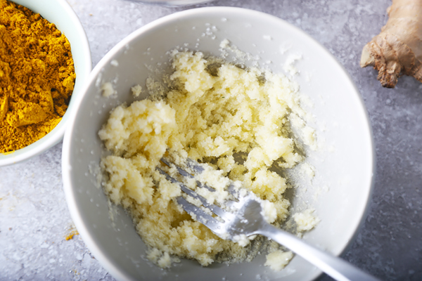 Butter and erythritol creamed together with a fork in a white bowl