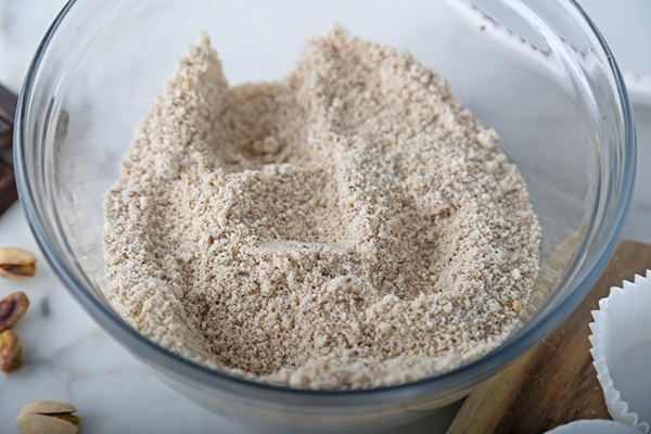 Almond flour, erythritol, cinnamon, and nutmeg whisked together in a glass bowl