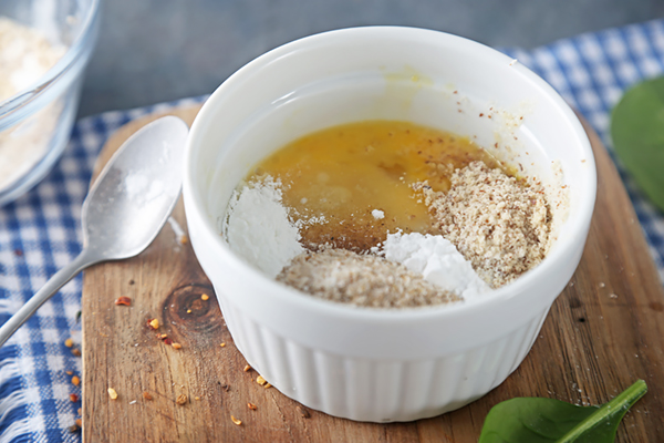 Almond flour, psyllium husk powder, and baking powder added to the egg mixture