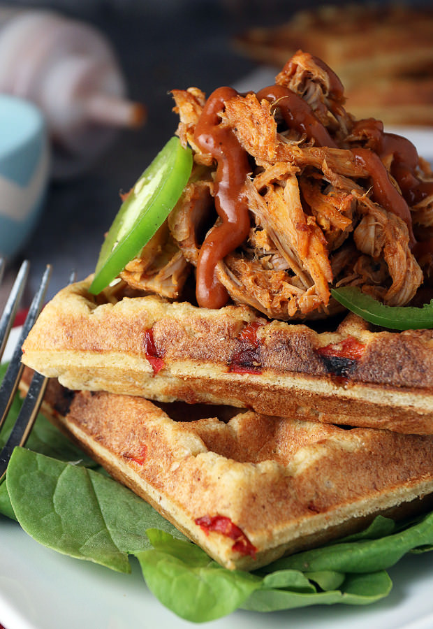 Tender and juicy BBQ Pulled Pork layered on a crisp "cornbread" waffle! Shared via www.ruled.me/