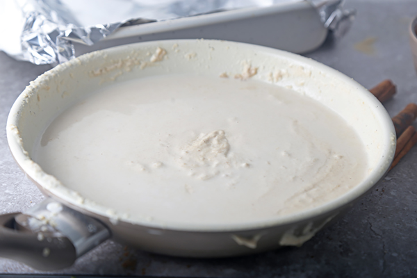 Melted coconut butter pooled smooth and white in a saucepan