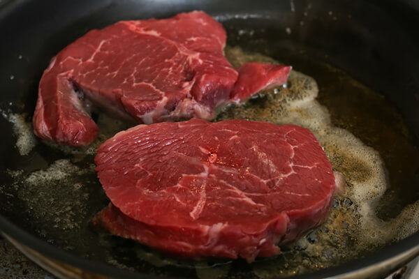 Pan searing steak.