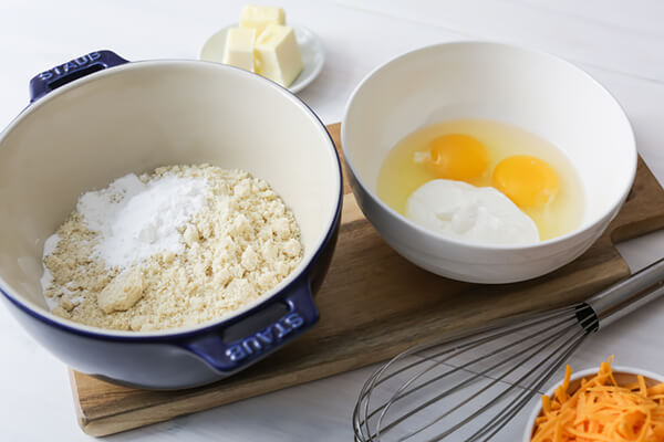 Dry ingredients in a bowl and wet ingredients in another bowl.