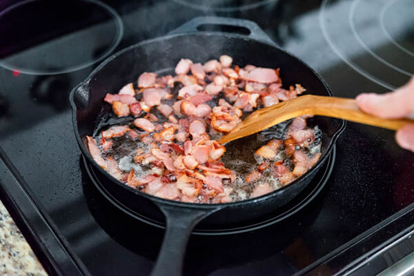 Frying bacon.