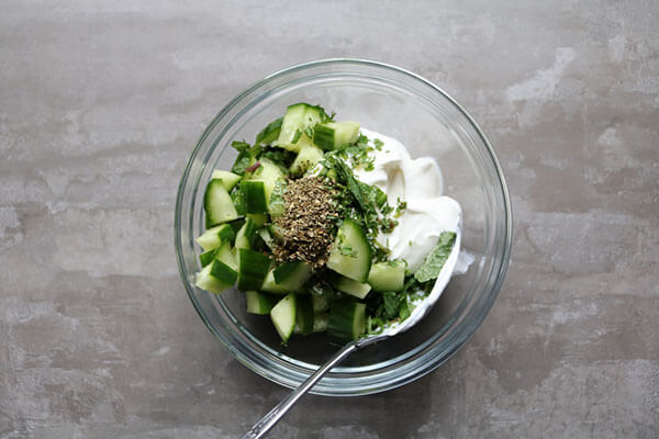Mixing the ingredients for the mint yoghurt dip.