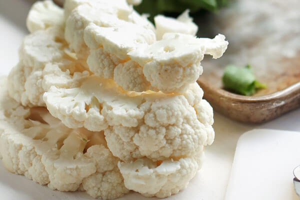 Stacked cauliflower steaks.