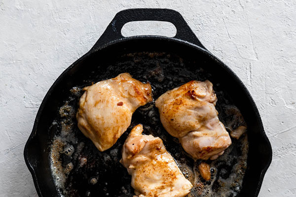 Frying the chicken.