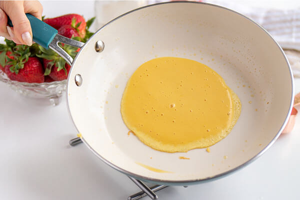 Adding the batter to the pan.