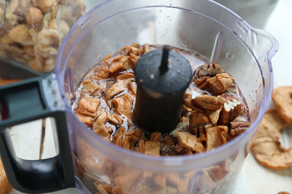 Pecans, freeze dried apples, and coconut butter loaded into a food processor