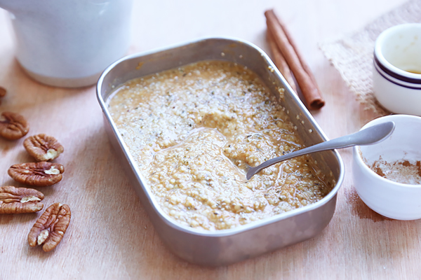 Overnight pumpkin spice mixture thickened with chia seeds, stirred with a spoon