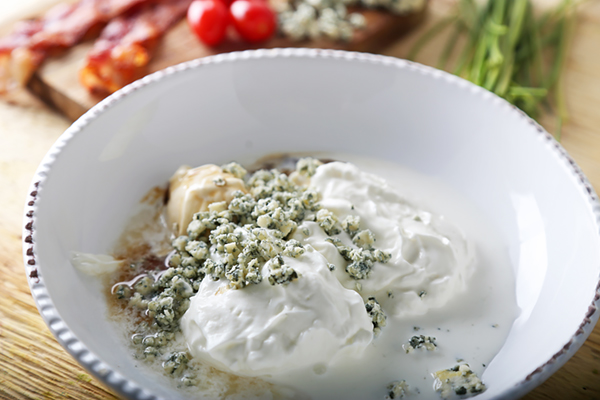 Blue cheese crumbles, sour cream, and balsamic vinegar stirred together for wedge salad dressing